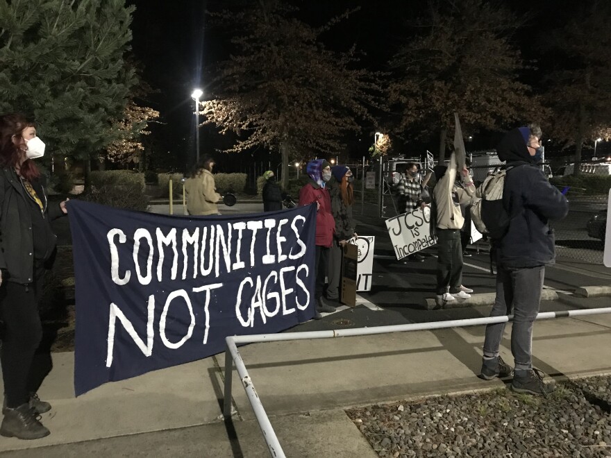 Activists gather outside of the Jackson County Jail