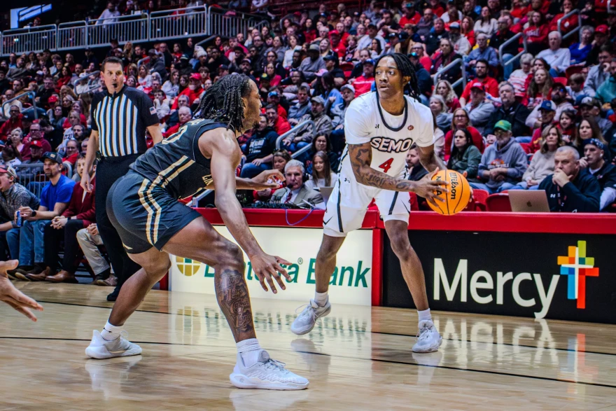 Junior forward Troy Cole Jr. looks to score against Lindenwood freshman and New Madrid, MO native Jadis Jones.