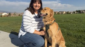 Christine Hull and Milo Bear pose for the camera, sharing a smile on a warm August morning.