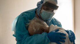 Physician hugs and comforts a patient in the COVID-19 intensive care unit (ICU) in Houston, Texas.