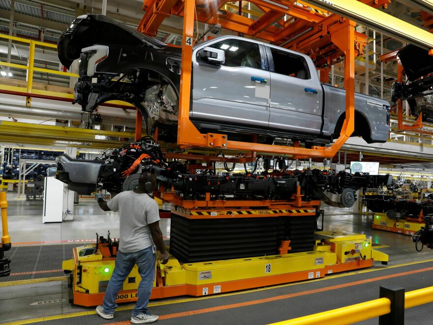 An F-150 Lightning truck is being produced at Ford's Rouge Electric Vehicle Center in Dearborn, Mich., on Sept. 20, 2022. Automakers say they can't meet the UAW contract demands in part because of the billions of dollars they are pouring into the transition to electric vehicles.