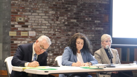 Members of the Kentucky Public Service Commission listen to residents in Ashland on Jan. 8. From left, Andrew Wood, Chair Angie Hatton and Mary Pat Regan.