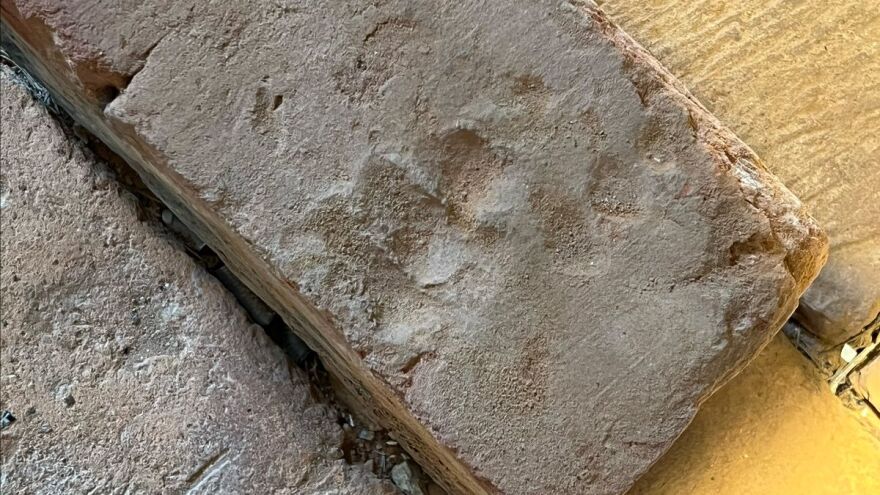 brick shows the fingerprints of its maker — probably an enslaved child.