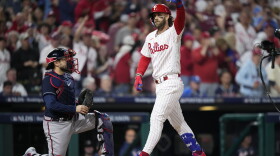 Philadelphia Phillies' Bryce Harper reacts after hitting a home run during the fifth inning of Game 3 of a baseball NL Division Series against the Atlanta Braves Wednesday, Oct. 11, 2023, in Philadelphia. (AP Photo/Matt Slocum)