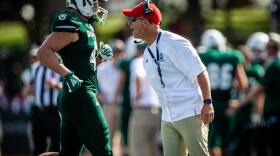Action shot of Coach Rich Wright during a football game