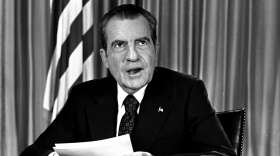 President Nixon sits in his White House office, Aug. 16, 1973, as he poses for pictures after delivering a nationwide television address dealing with Watergate. (AP Photo)