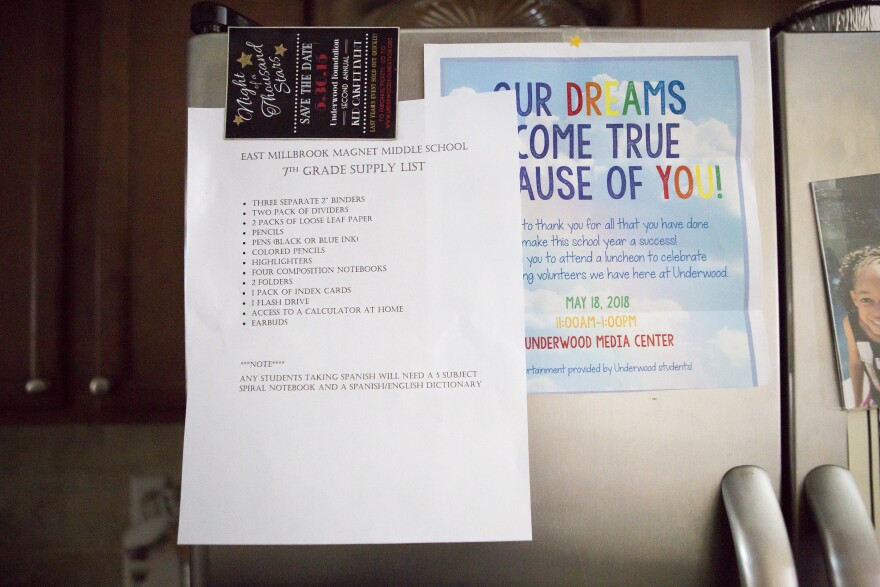 A list of school supplies for the upcoming year hangs on the refrigerator at the home that Kaiden and Karisma Clark share with their mom Ayeisha Owens and their great-grandmother Maude Owens.