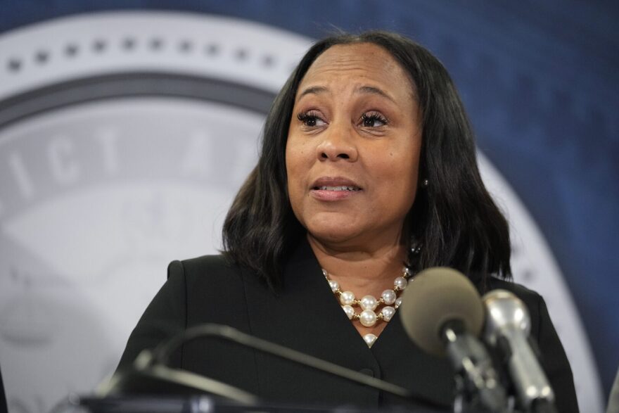 FILE - Fulton County District Attorney Fani Willis speaks in the Fulton County Government Center during a news conference, Monday, Aug. 14, 2023, in Atlanta. Donald Trump and several allies have been indicted in Georgia over efforts to overturn his 2020 election loss in the state.