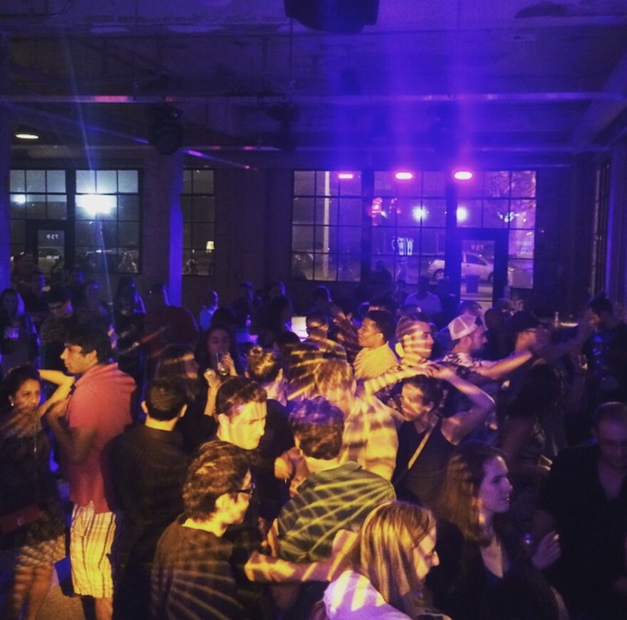 Patrons fill the dance floor at Work|Release during a late-night event.