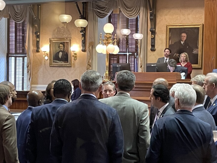 S.C. senators huddle Thursday, Jan. 30, 2025, in the Senate chamber during a debate about the state Education Lottery-funded K-12 education voucher bill. In the middle is the bill's sponsor, Senate Education Chairman Greg Hembree, R-Horry.