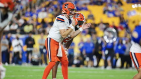 Syracuse quarterback Steve Angeli (9, White) readies to take a snap in SU’s 27-13 loss to Pittsburgh on Thursday.