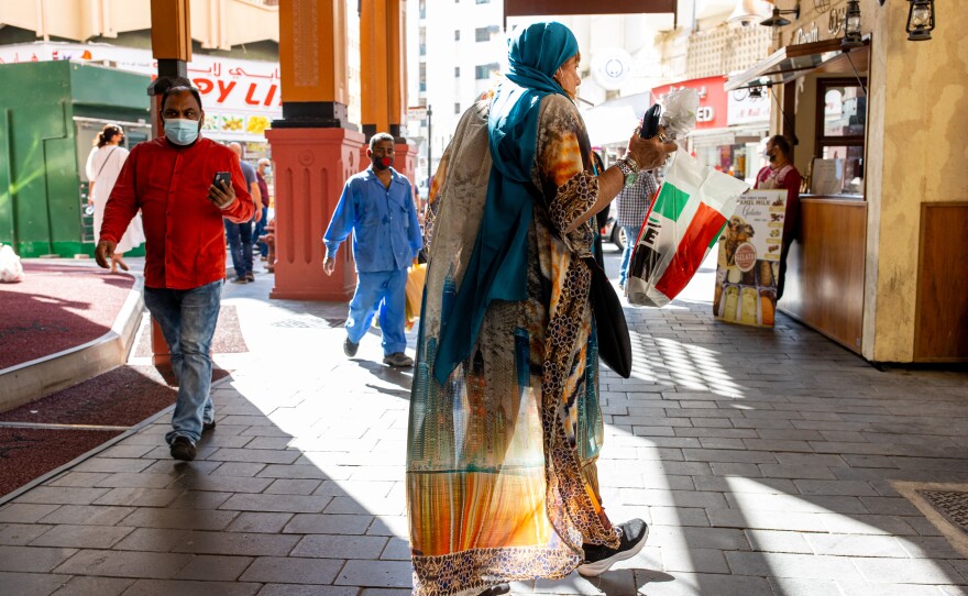 Israeli tour guide Lihi Ziv (center) walks through the Deira district near the Grand Souq in Dubai.