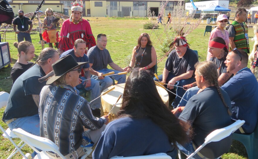 People in a drum circle.