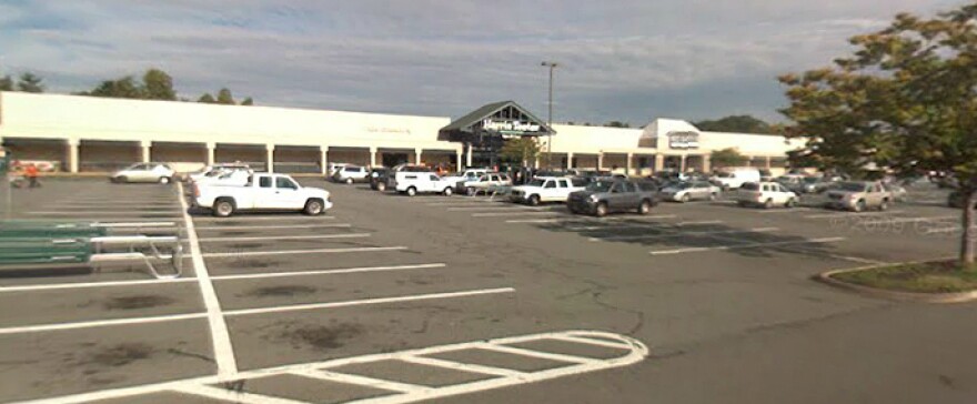 A college student spent the night in jail and was charged with felony counts after agents approached her car, suspecting she bought beer at this Harris Teeter grocery store in Charlottesville, Va.