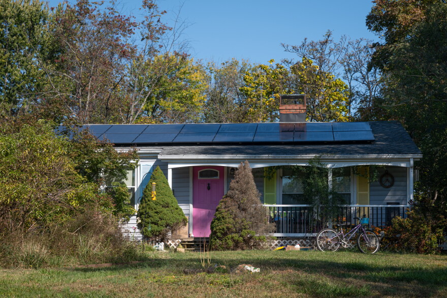 Home with solar panels in rural Albemarle County.