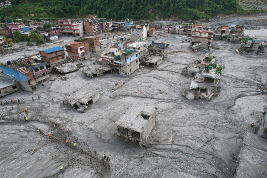 A drone view of the aftermath of flash flooding along the Trishuli River in the Devighat area of Nuwakot district, Nepal, Saturday, Aug. 29, 2026. 