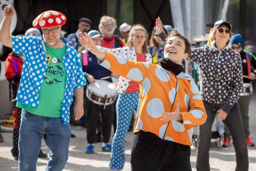 Rosalie Norris leads a troupe of Honk dancers at an impromptu performance at Harvard's Science Center Plaza, in Cambridge, Mass. (Robin Lubbock/WBUR)