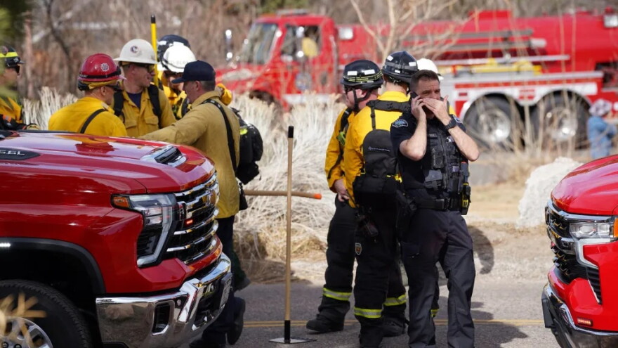 Firefighters and law enforcement get ready to work the Bluebell fire Saturday, Feb. 28, 2026, near Boulder.