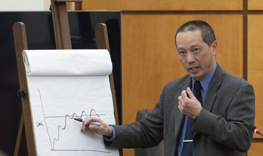 Asa Louis, a research scientist with the Washington State Patrol toxicology lab, explains how breaks in taking drugs affects the body to prosecuting attorney Kent Liu (not in photo) during the trial of three Tacoma Police officers regarding the killing of Manny Ellis at Pierce County Superior Court, Thursday Nov. 30, 2023, in Tacoma, Wash. Tacoma Police Officers Christopher Burbank, Matthew Collins and Timothy Rankine stand trial for charges related to the March 2020 killing of Manny Ellis.