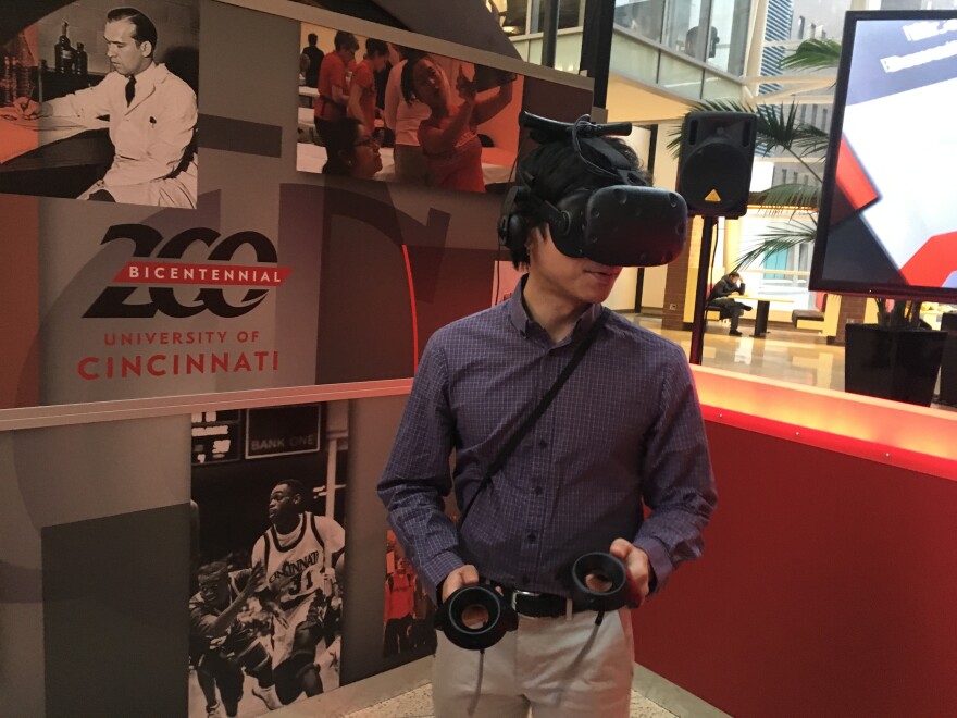 Mark Lim tries out UC's VR vignettes to commemorate the university's bicentennial.