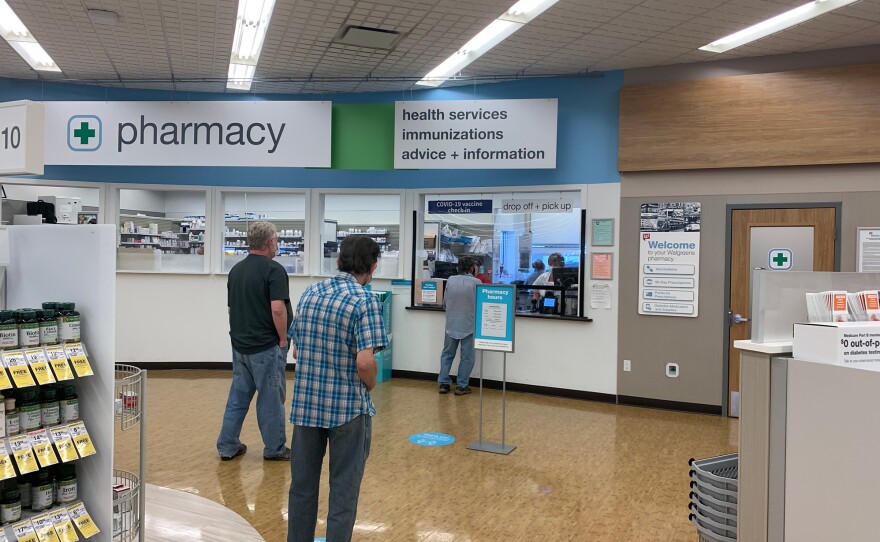 Residents line up for COVID-19 vaccinations inside a Walgreens in Hartsville. The local pharmacy across the street also offers vaccinations, along with the public health department around the corner.
