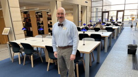 Library of Michigan Special Collections Manager David Votta stands in the library's atrium