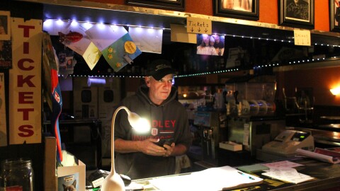 Dan Conlin selling tickets at the Jukebox Comedy Club.