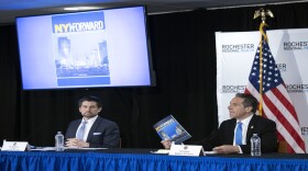 Gov. Andrew Cuomo gives his daily coronavirus briefing on Monday in Rochester, one of three regions in the state to begin reopening soon. Top aide Jim Malatras is at left. 