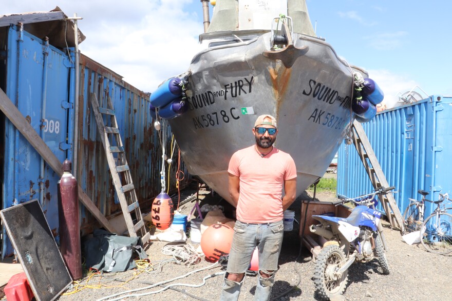 Fisherman Chris Rhoades in front of the F/V Sound and Fury.