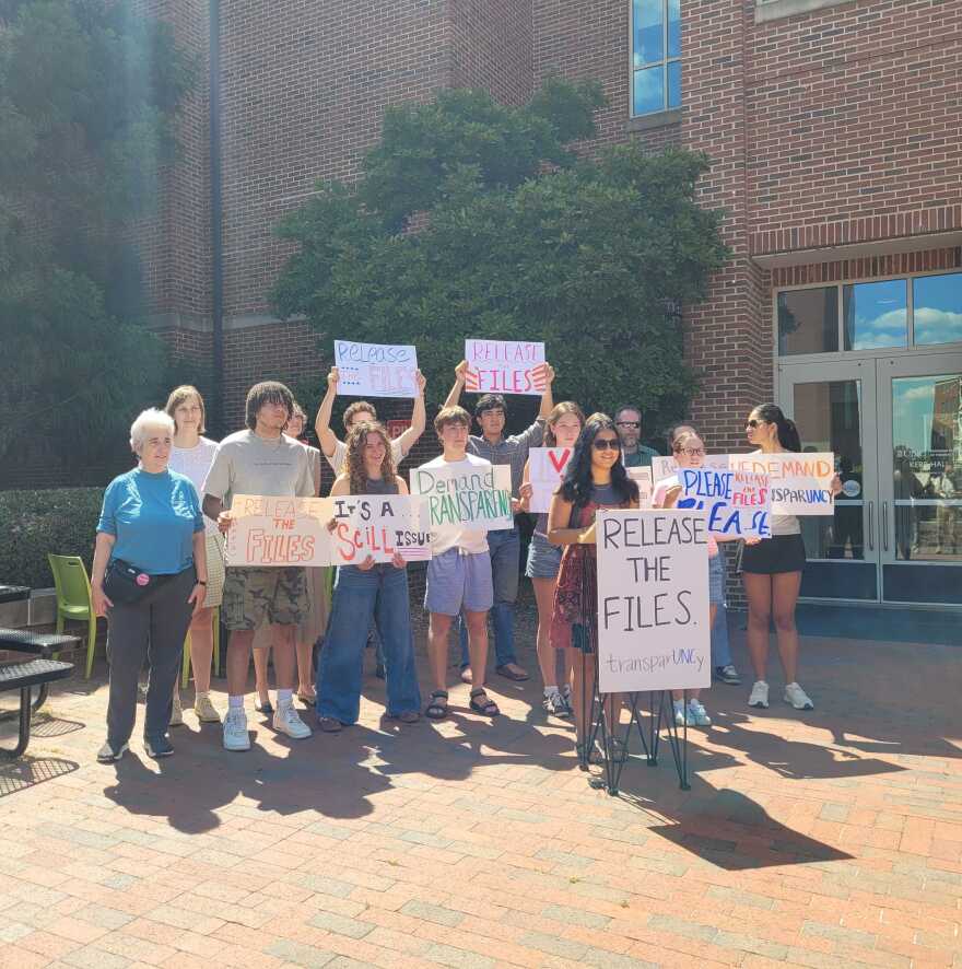 Students and faculty with TransparUNCy, the Sunrise Movement, the Black Student Movement, and the American Association of University Professors (AAUP) hold a protest shortly before the faculty council meeting.