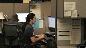 Sedgwick County workers take calls in the newly launched 988 mental health hotline center. 