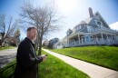 David Shuman, principal broker at Bay North Realty, talks about a large home for sale on Bay Street in Petoskey. The six bedroom and 3.5 bathroom home is listed for nearly $2 million. (Photo: Kathy Kieliszewski/Bridge Michigan)