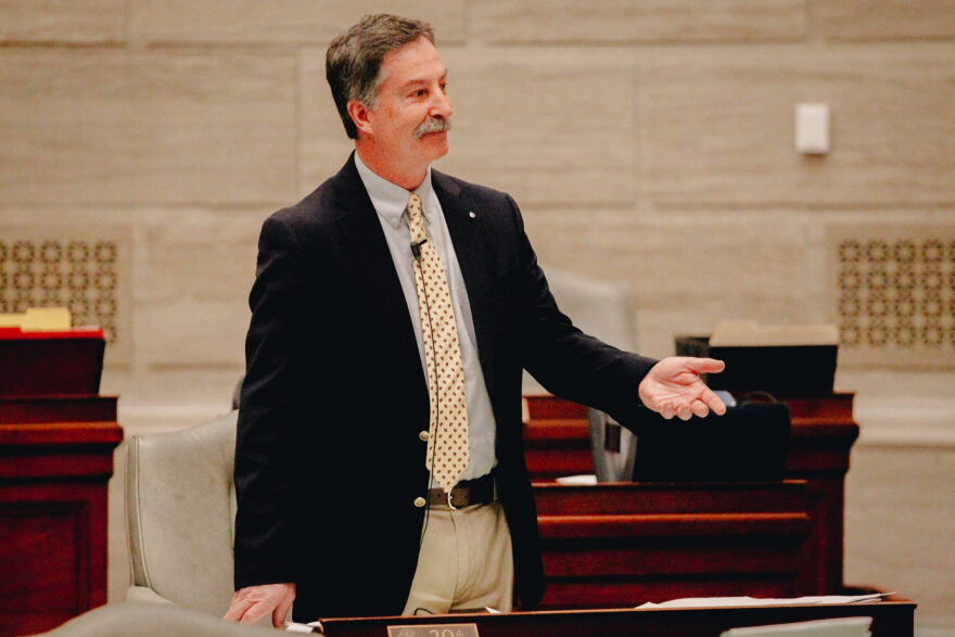 Republican Sen. Mike Moon protests his punishment for wearing overalls on the Senate floor on Feb. 22, 2022.