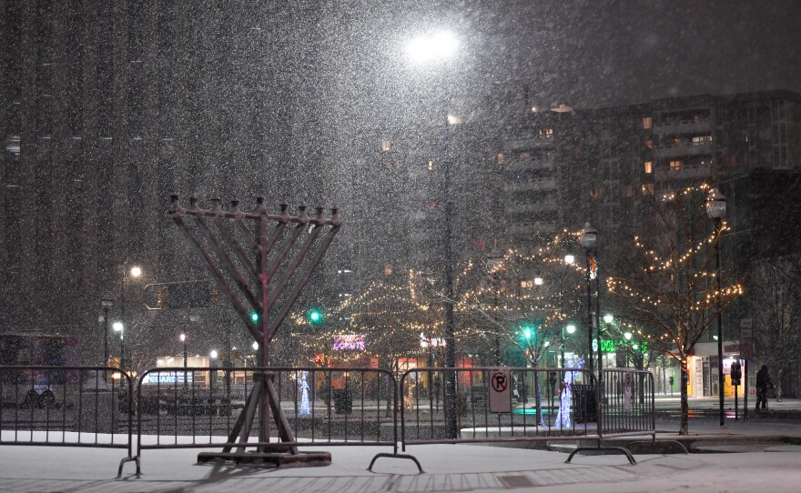 Heavy snow begins to fall on Public Square in Wilkes-Barre Saturday evening.