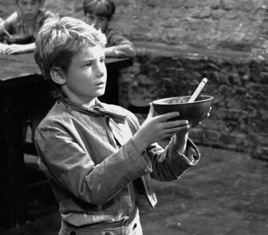 Poor orphan Oliver Twist was one of the 989 named characters Dickens created during his prolific career. Above, Mark Lester asks for more gruel during the 1967 filming of <em>Oliver!</em>