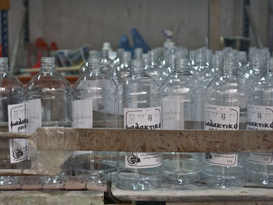 Empty bottles that will hold fabric softener made with vinegar and lavender.