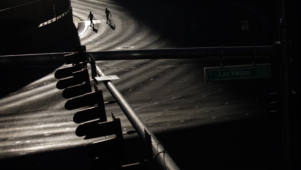 People cross the street along the Las Vegas Strip, Tuesday, April 14, 2020.