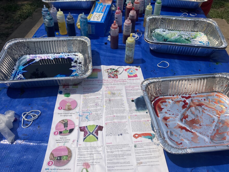 Kids made crafts at the LGBTQ pride picnic, like this station for tie-dye shirts.