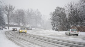 Cars lurch along on snow-covered roads in Ballwin. Many parts of the St. Louis region reported more than 6 inches of snow accumulation by Monday afternoon, according to 5 On Your Side. 