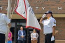 Chelsey Jourdain, back right, stands next to Bemidji Mayor Jorge Prince, back left, as the Red Lake Nation flag is raised by the color guard on July 25, 2025.