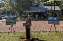 Leon County Parks and Recreation Director Amanda Heidecker makes remarks in front of the half-court basketball space now under construction at the Tower Road Park.