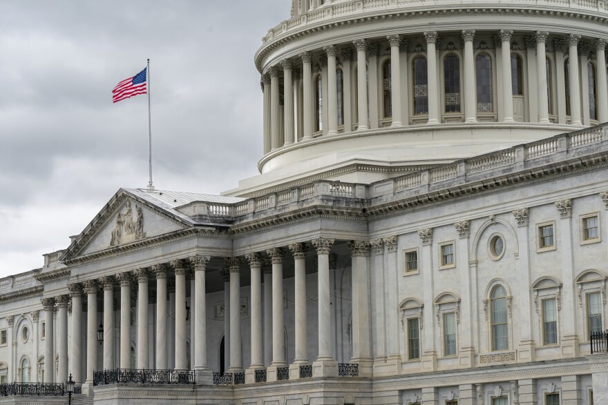 The Capitol is seen in Washington against a cloudy sky.