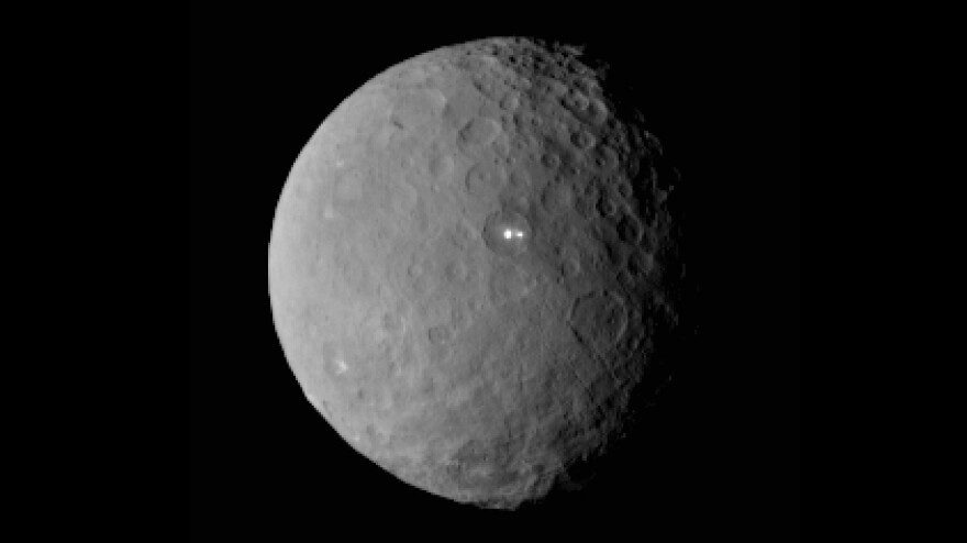 In February, NASA shared this image of Ceres taken by the Dawn spacecraft, showing two bright spots on the dwarf planet.