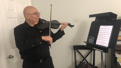 Violinist and teacher Gustavo Correa playing in his home studio in Boca Raton.