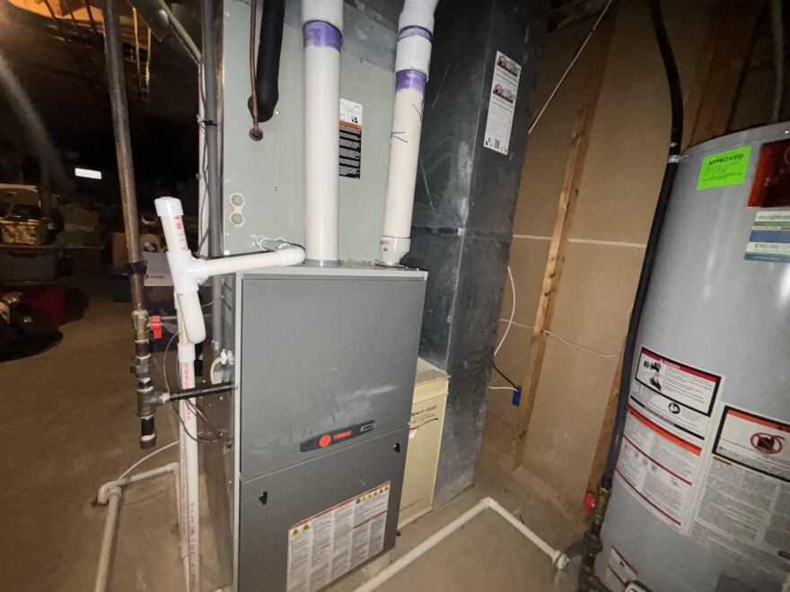 Furnace in the basement of a residence.