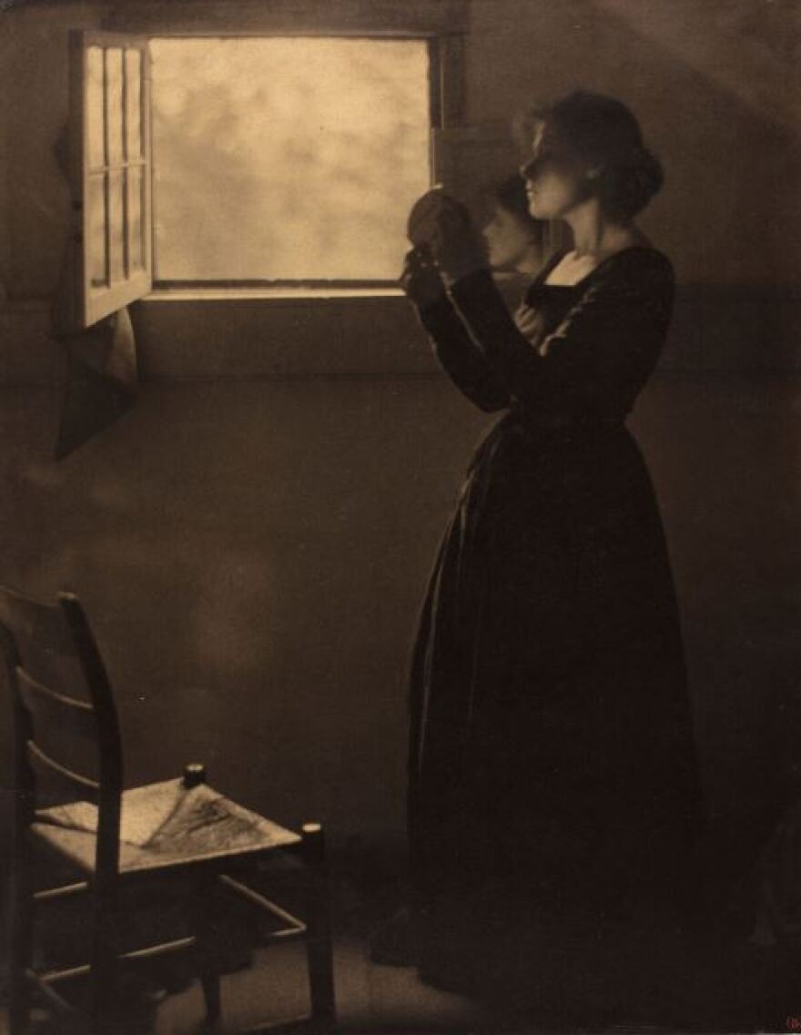 'Girl with Mirror' 1912, printed after 1917. Clarence H. White. Varnished palladium print.