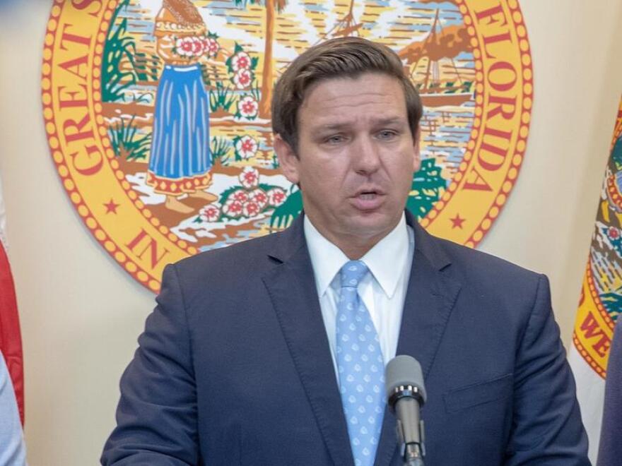 Gov. Ron DeSantis at a podium