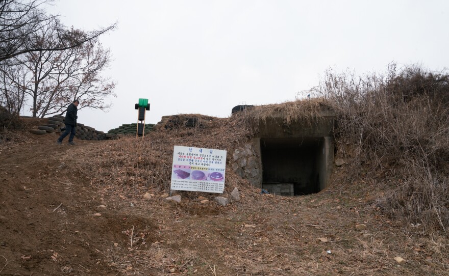 Kim Seung-ho walks past a bunker near the Imjin River in an unrestricted area outside South Korea's Civilian Control Zone.