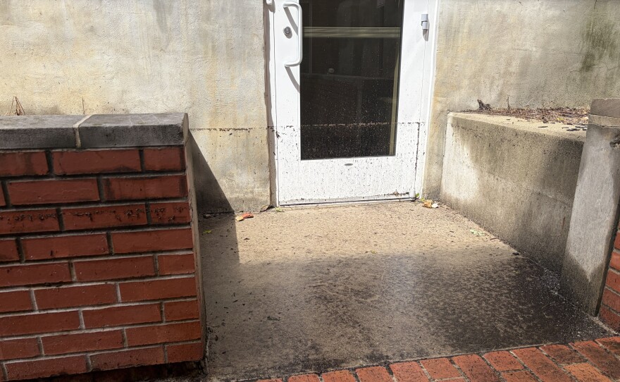 The line of dirt outside ISU's Fell Hall shows how high the water reached.