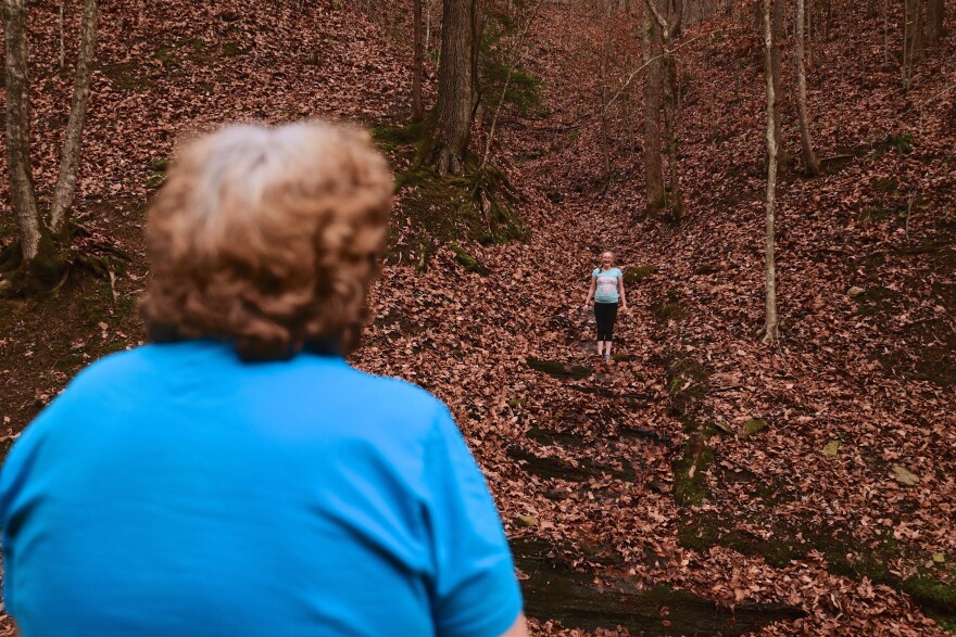 Maggie Hill, 67, watches Charity play in Madison, W.Va., on Thursday, Nov. 29, 2018. Hill adopted the 10-year-old girl about five years ago. Hill's son had been raising her but lost custody during his ongoing struggle with drug addiction, Hill said.